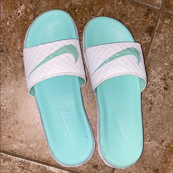 teal and white nike slides